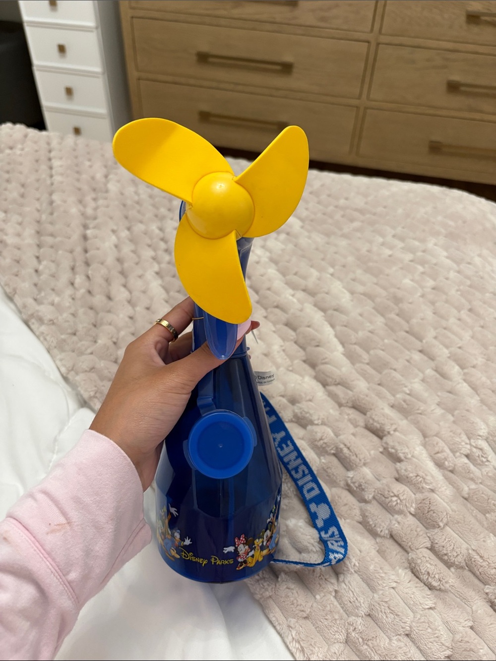 Discontinued Disney Blue Handheld Fan with Yellow Blades and Character Strap